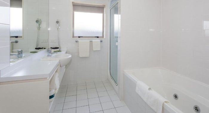 fully titled spotless bathroom
